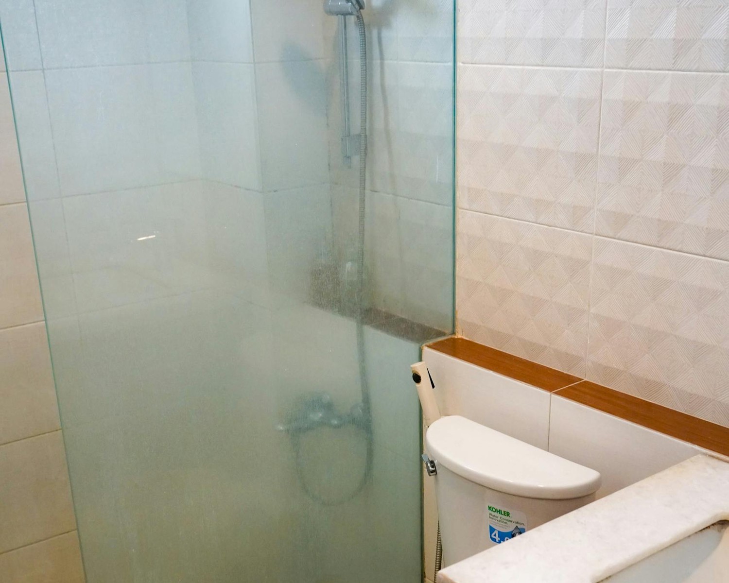Bathroom before safety upgrades with limited support and tighter circulation